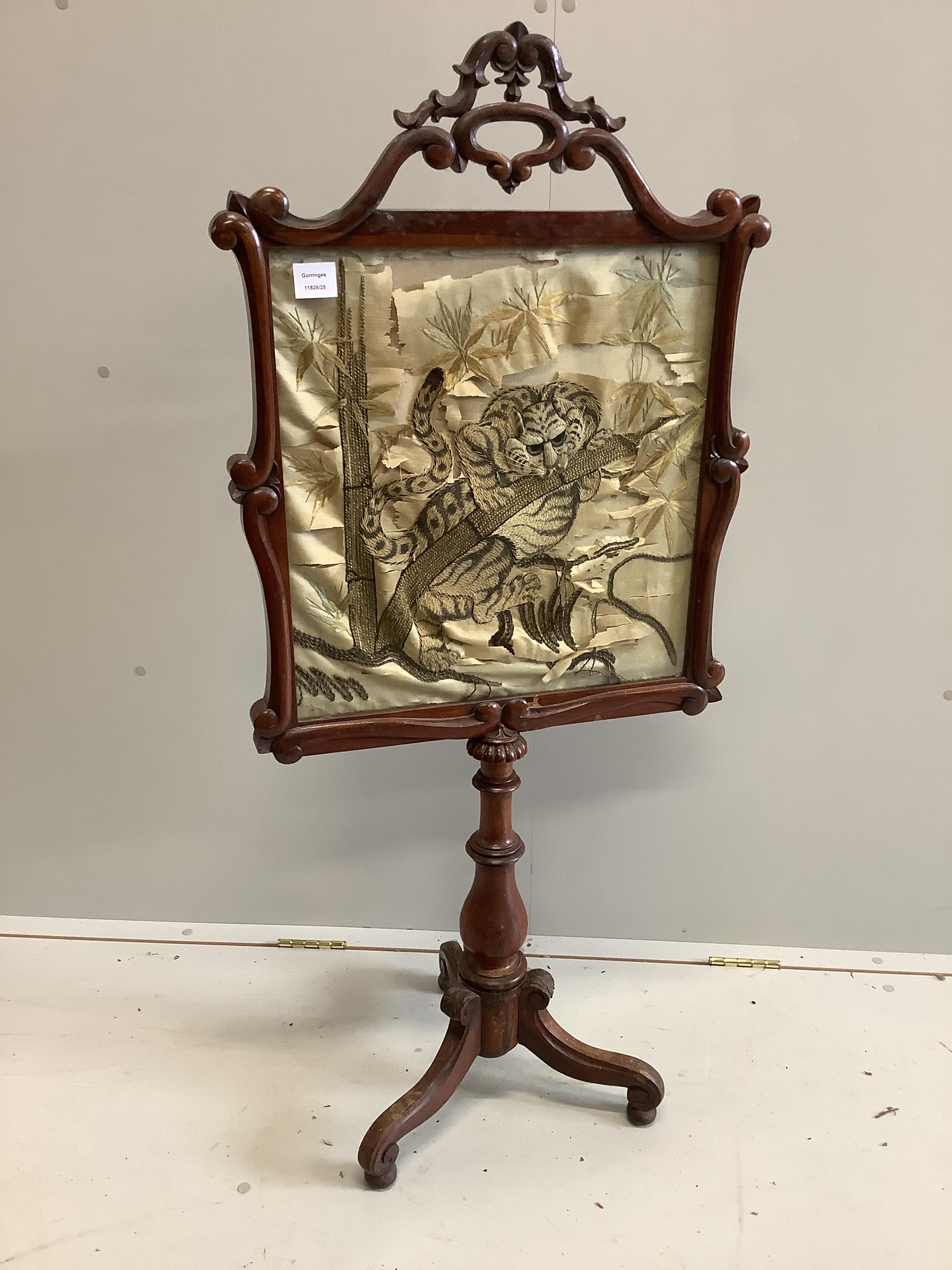 A Victorian rosewood polescreen, inset Japanese embroidered panel, decorated with a tiger, height 128cm